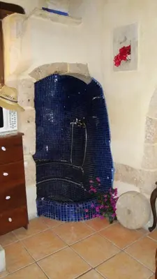a shower in a room with a blue net at Old Stone House in Chania Town
