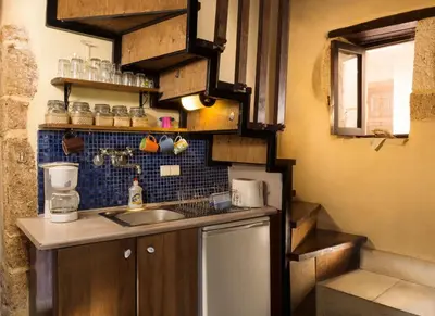 a small kitchen with a sink and a counter at Old Stone House in Chania Town