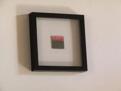 a picture frame hanging on a wall at Trouli House in Stalos