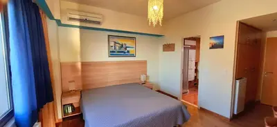 a bedroom with a bed in a room at Panoramic Sea View in Chania Town