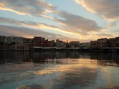 a view of a city with buildings and a body of water at Harmony Apartments in Kato Daratso