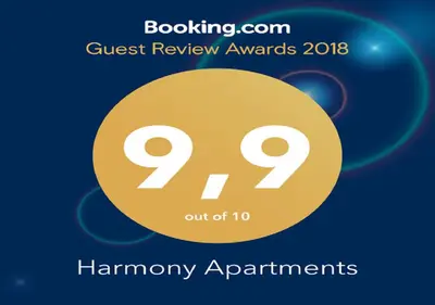 a sign that says guest review awards with a yellow circle at Harmony Apartments in Kato Daratso