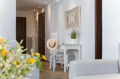 a living room with a table with a hat on it at Villa Oleander in Kounoupidhianá