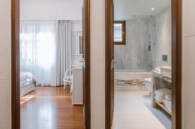 a large bathroom with a tub and a sink at Villa Oleander in Kounoupidhianá