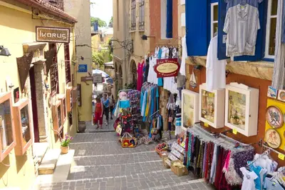 a narrow street in a city with shops at Villa Selena in Stalos
