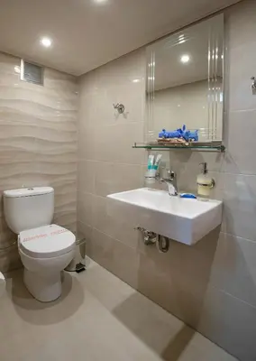 a bathroom with a toilet and a sink at Casa Alba Seaview House in Chania Town