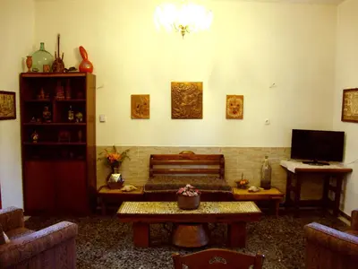 a living room with a couch and a table at Venezian Castle House in Kissamos