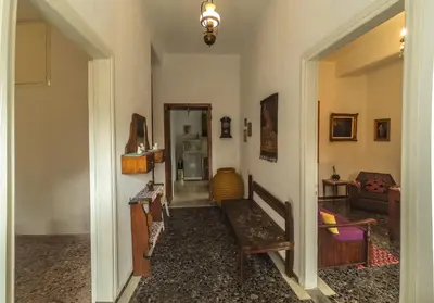 a hallway with a stairway leading to a living room at Venezian Castle House in Kissamos