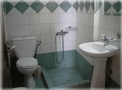 a bathroom with a toilet and a sink at Constantinos Studios in Chania Town