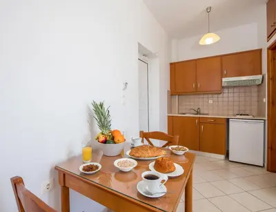 a kitchen with a table with food on it at Joanna's Place in Palaiochóra
