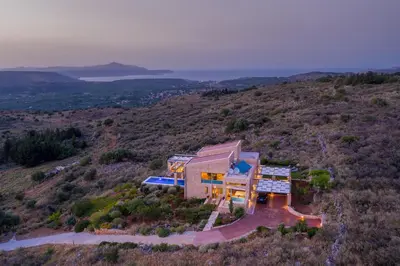 an aerial view of a house on a hill at Kaminia Villa in Makhairoí