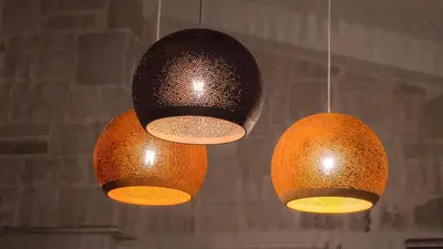 a couple of lights hanging from a ceiling at Villa Mathea in Kounoupidhianá
