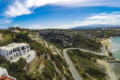 an aerial view of a house and a road at Kalathas Sunset Villa in Kalathas