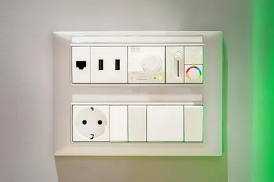 a white lightswitch on a wall with white controls at Splanzia Boutique Hotel in Chania Town