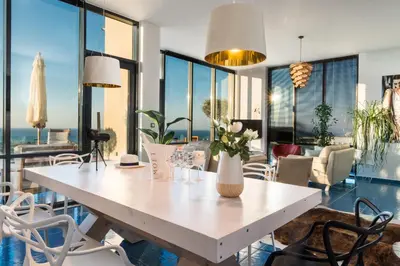a dining room with a white table and chairs at Villa Emanuele in Gerani Chanion