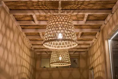 a large chandelier hanging from a wooden ceiling at Sea & City Apartments in Chania Town