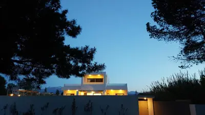 a house with lights on top of a building at Sea Queen Villa in Kato Daratso