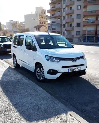 a white van parked in a parking lot at Κatakis Villas in Agios Onoufrios