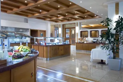 a large kitchen with a island with fruits on it at Thalassa Beach Resort & Spa (Adults Only) in Agia Marina Nea Kydonias