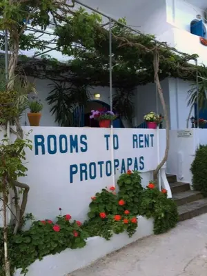 a sign that reads rooms to rent protoporphres at Protopapas Rooms in Loutro