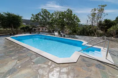 a swimming pool with a stairway leading to it at Dekem Residence in Gavalochori