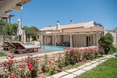 a villa with a swimming pool and a house at Geraniotis Villa in Gerani Chanion