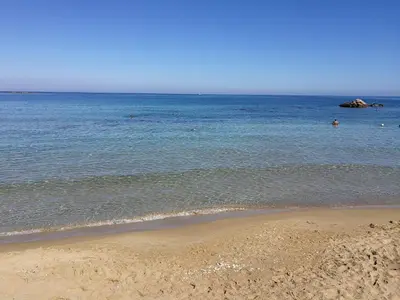 a beach with a body of water and the ocean at Casa di Gouto in Chania Town
