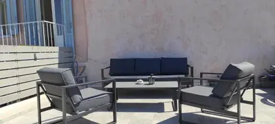two chairs and a table on a balcony at Casa di Gouto in Chania Town