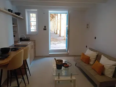 a living room with a couch and a table at Sotoportego in Chania Town
