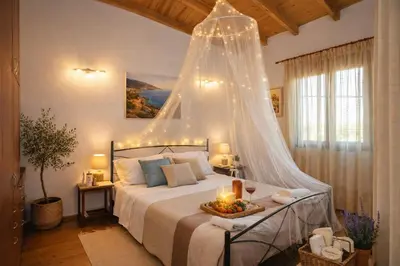 a bedroom with a bed with a net canopy at Melli House in Melissouryíon
