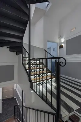 a staircase in a building with black railings at Elia Portou Due in Chania Town
