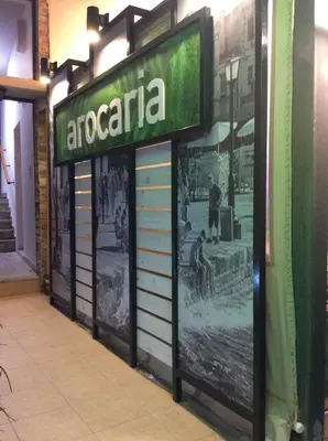 a sign for an americeria on the side of a building at Arocaria Apartments in Chania Town