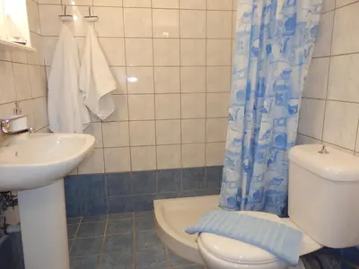 a bathroom with a toilet and a sink at Maro Suites in Tavronitis