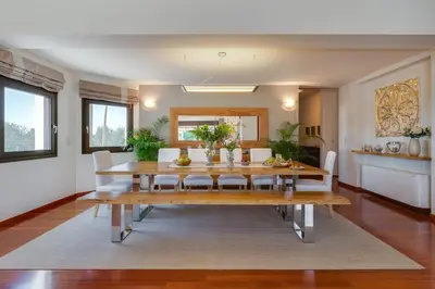 a dining room with a table and chairs at Villa Ampelaki - Premium Villa with heated pool in Kounoupidhianá