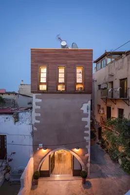 an external view of a building with an archway at Casa Regina Luxury House in Chania Town