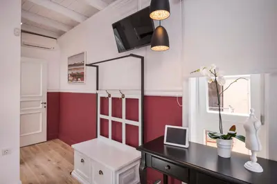 a room with a desk and a mirror on a wall at Casa Regina Luxury House in Chania Town