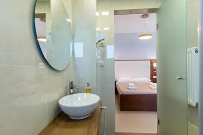 a bathroom with a sink and a mirror at Villa Aretousa 2 in Agia Marina Nea Kydonias