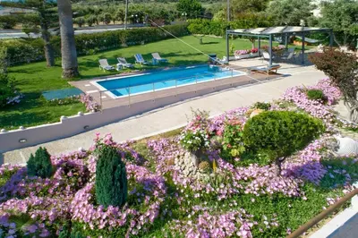 an overhead view of a garden with flowers and a swimming pool at Santy Villa - Gerani in Gerani Chanion