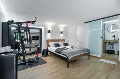 a bedroom with a bed and a gym at Santy Villa - Gerani in Gerani Chanion