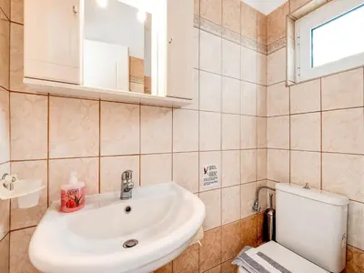 a bathroom with a sink and a toilet at Villa in Kalamitsi near White Mountains in Kalamítsion Alexándrou