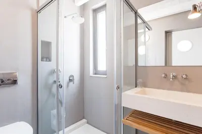 a bathroom with a shower and a sink at Happy Villa in Kato Galatas