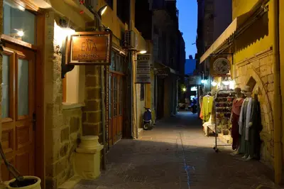 an alley with a sign on the side of a building at Elia Dorotheou in Chania Town