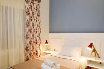 a bedroom with a bed with two towels on it at Elia Dorotheou in Chania Town