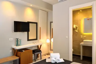 a hotel room with a bathroom with a sink at Elia Dorotheou in Chania Town