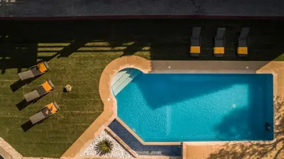 an overhead view of a swimming pool in a yard at Villa Fabrica in Thimiá