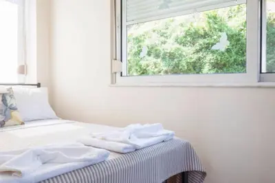 a bedroom with a bed with towels on it at Domus Creta in Kato Daratso
