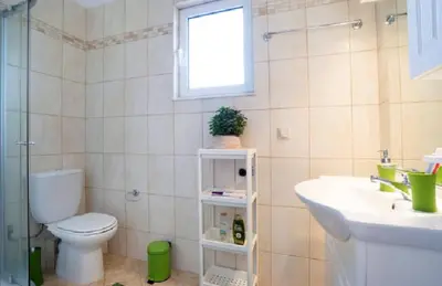 a bathroom with a toilet and a sink at Domus Creta in Kato Daratso