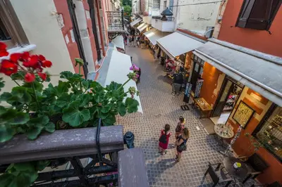 an overhead view of a street with people walking down a street at 11City Rooms in Chania Town