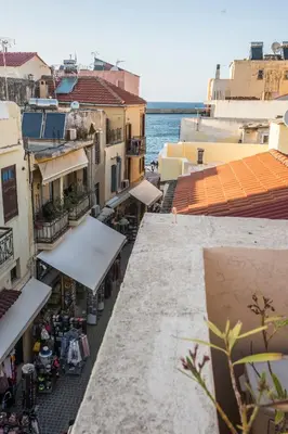 an overhead view of a street with buildings and the ocean at 11City Rooms in Chania Town