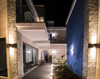 a hallway of a house at night with lights at Blue Horizon in Palaiochóra
